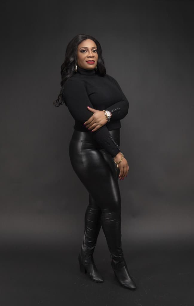 Studio headshot of a woman in black