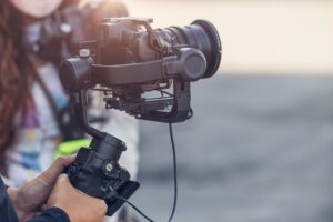Motorized Gimbal, people using digital camera with anti shake for video production scene stabilizer