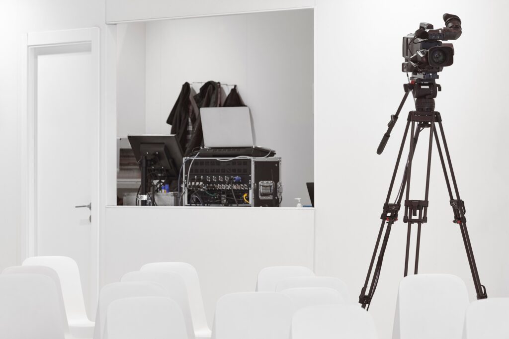 TV control room with video camera. Conference hall. Broadcasting production