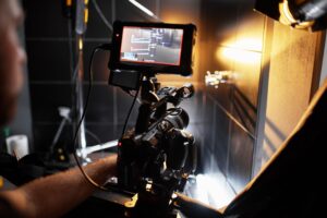 Video production backstage. Behind the scenes of creating video content, a professional team of